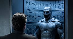 Bruce e disfarce de batman